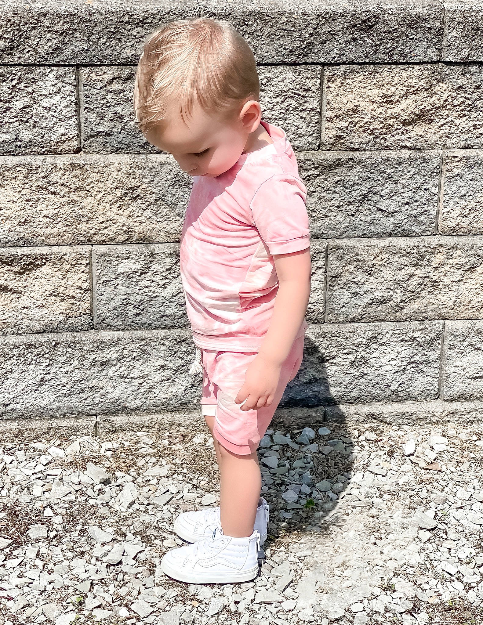 Aslan joined the competition — help win amazing prizes! arm, baby, baby_toddler_clothing, child, face, flooring, foot, grass, hair, human_body, human_leg, pattern, people_in_nature, person, sitting, skin, sleeve, standing, t_shirt, toddler