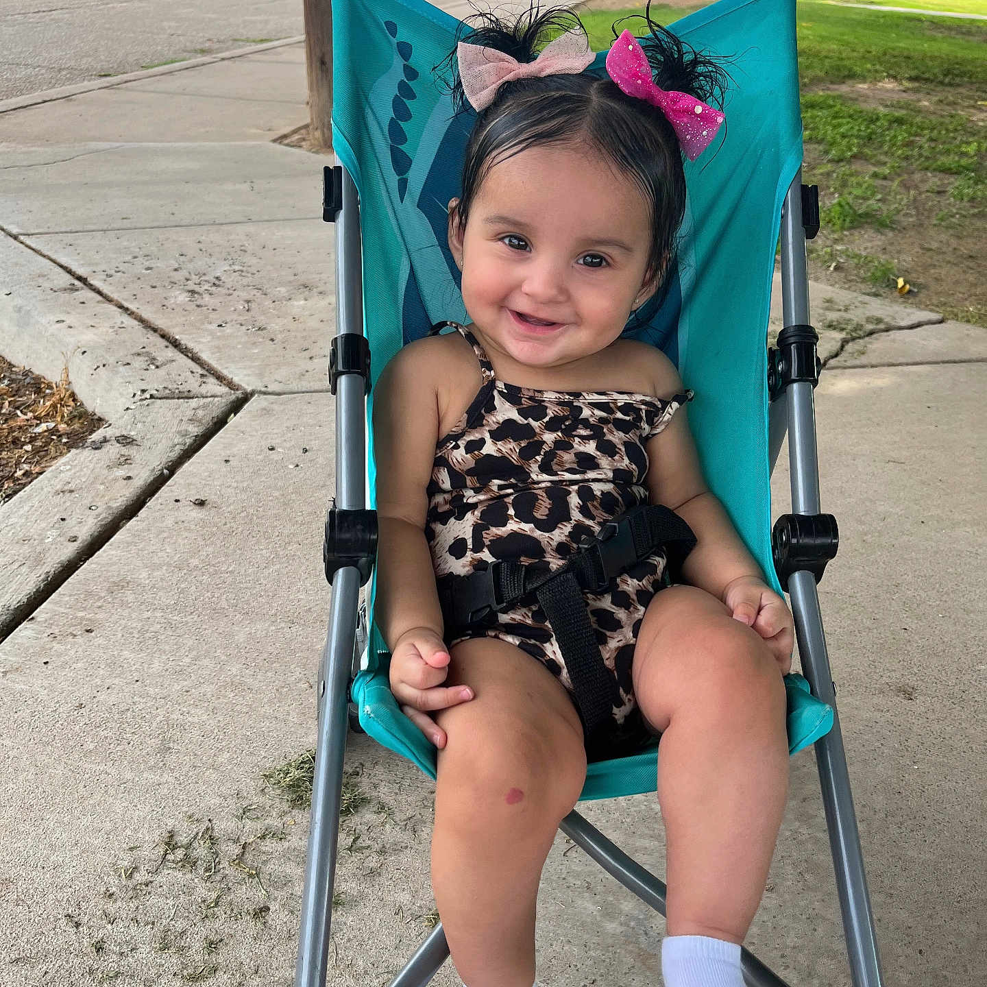 Jayselina joined the competition — help win amazing prizes! baby, casual, child, concrete, cute, greenery, hair_bows, happy, leopard_print, outdoor, playful, portrait, seatbelt, sidewalk, smiling, stroller, sunlight, toddler, white_socks, young_child