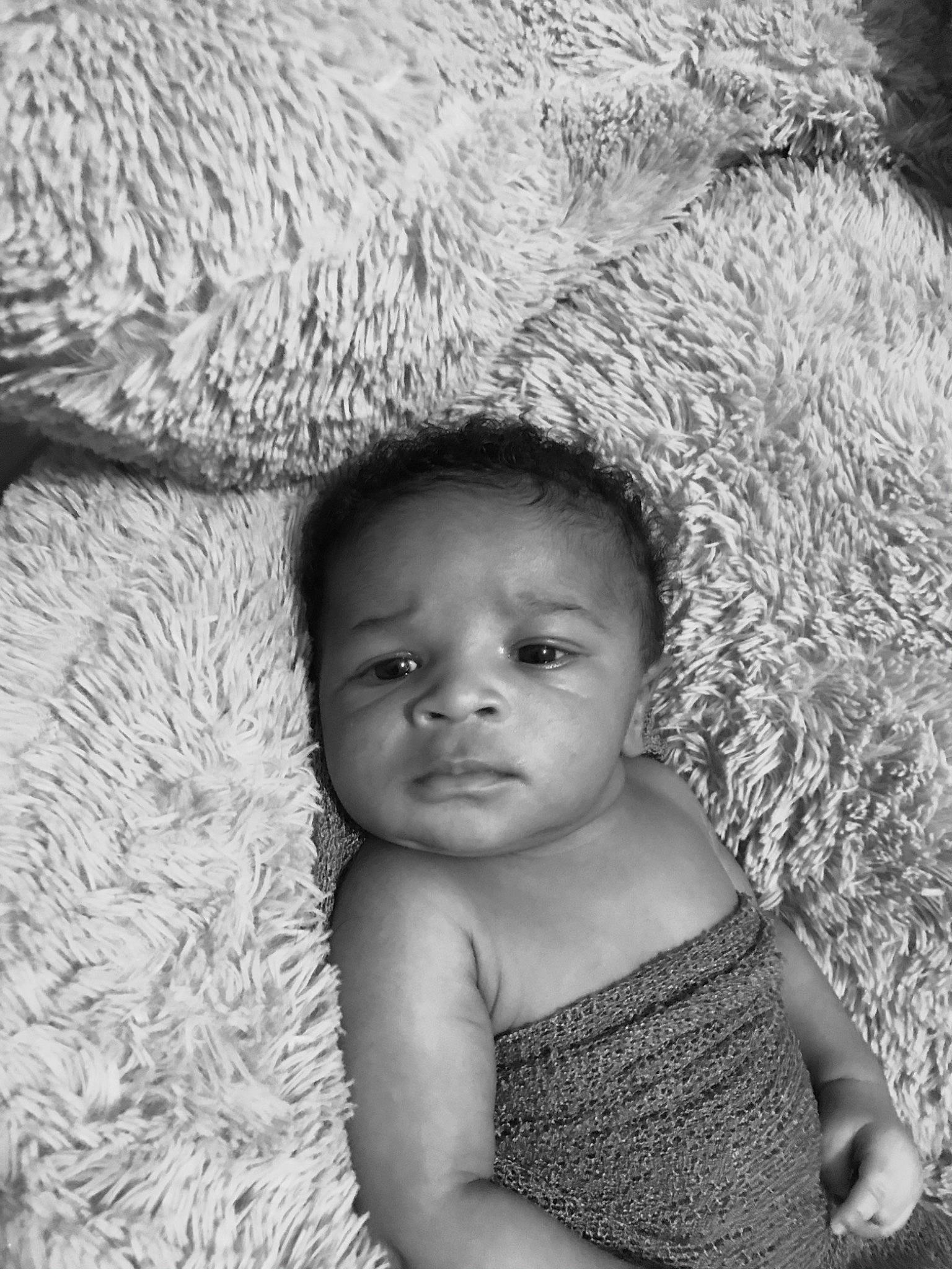Sekani is registered to the contest to win money with this photo: baby, beauty, black, black_and_white, eyebrow, eyelash, facial_expression, flash_photography, grass, happy, iris, monochrome, monochrome_photography, mouth, nose, person, photograph, skin, style, toddler