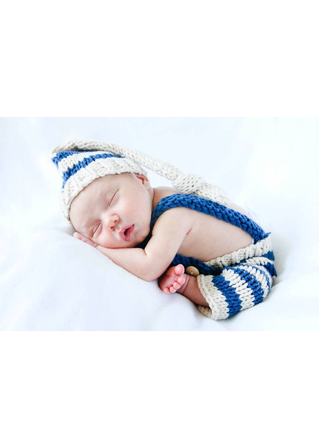 Malikai joined the competition — help win amazing prizes! baby, baby_sleeping, beanie, beige, blue, bonnet, cap, child, fashion_accessory, hair_accessory, headband, headgear, knit_cap, pattern, person, photograph, photography, portrait_photography, textile, toddler