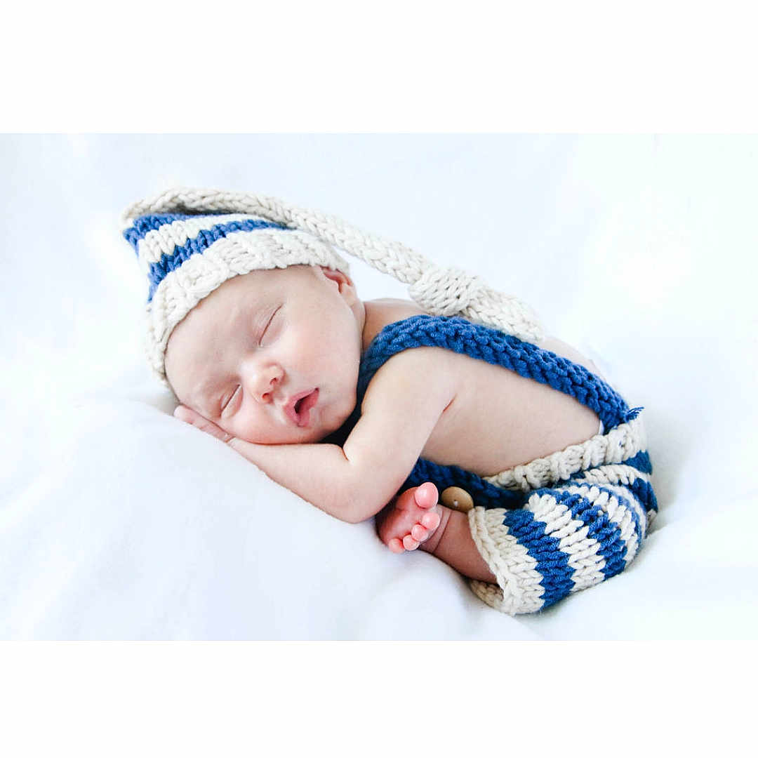 Malikai joined the competition — help win amazing prizes! baby, baby_sleeping, beanie, beige, blue, bonnet, cap, child, fashion_accessory, hair_accessory, headband, headgear, knit_cap, pattern, person, photograph, photography, portrait_photography, textile, toddler