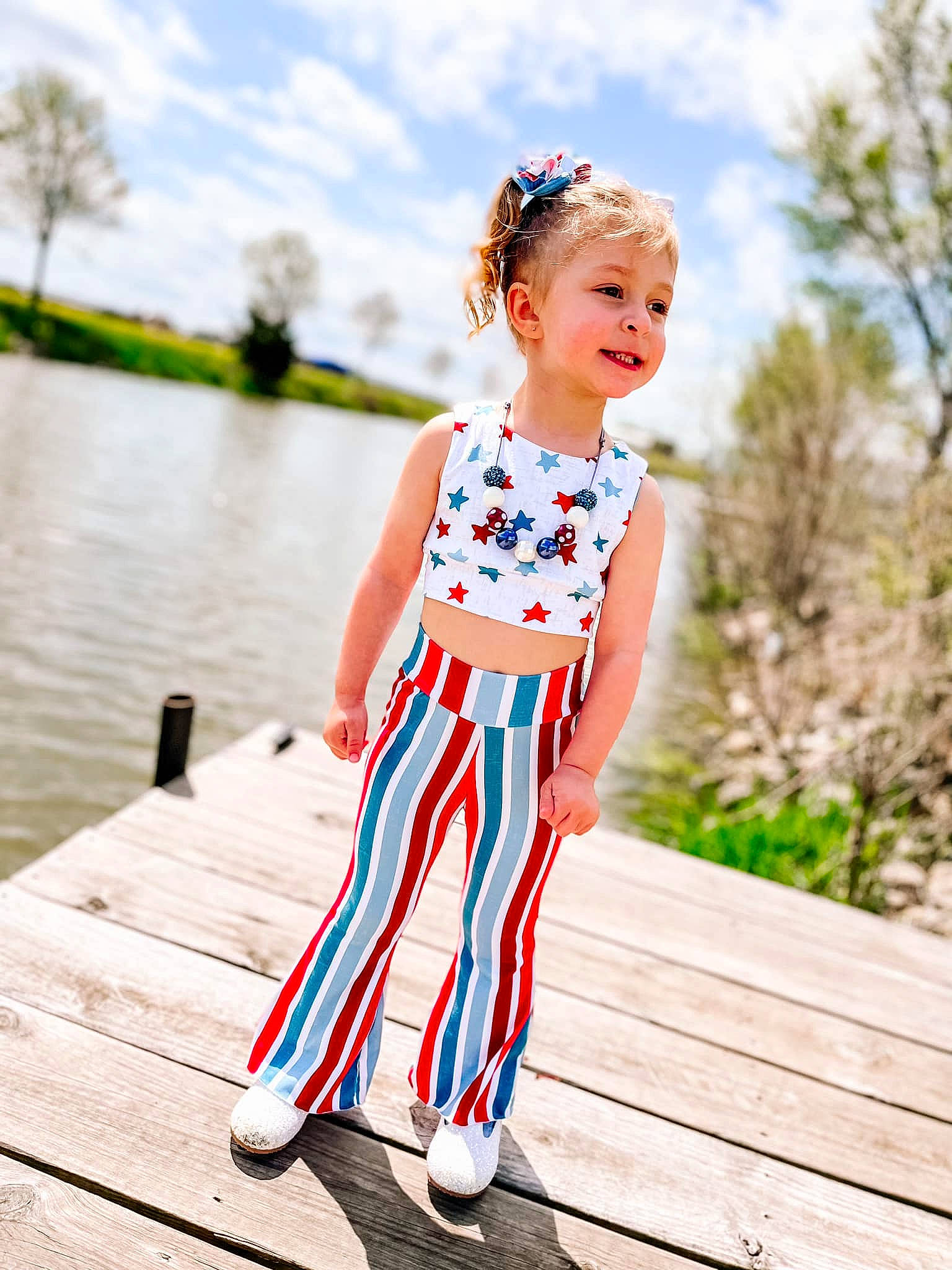 Natalie joined the competition — help win amazing prizes! baby_toddler_clothing, cloud, day_dress, dress, grass, happy, leg, leisure, one_piece_garment, people_in_nature, person, plant, sky, standing, street_fashion, summer, toddler, tree, waist, water