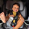 Josias is registered to the contest to win money with this photo: baby, baby_bottle, black_hair, car, car_interior, car_seat, child, child_safety, cute, foot, happy, infant, playful, portrait, safety, seat, seat_belt, smiling, toddler, yellow_clothing