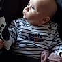Sasha participe au concours pour gagner de l'argent avec cette photo : baby, infant, child, striped_clothing, blue_eyes, soft_toy, blanket, seated, cushioned_seat, portrait, indoor, cute, looking_away, human, small_hand, cozy, striped_pajamas, face, head, expression