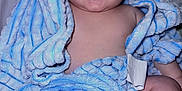 Thiago is registered to the contest to win money with this photo: baby, towel, blue, smile, happy, infant, skin, face, legs, feet, blanket, soft, cute, child, person, newborn, indoors, portrait, cozy, wrapped