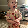toddler, child, baby, portrait, standing, surprised, open_mouth, smiling, strawberry, dress, indoor, home, carpet, storage_bins, window, sunlight, clothing, arms_crossed, face, photography