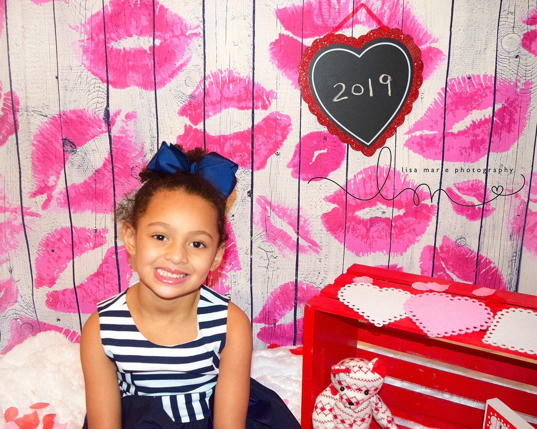 Aaliyah is registered to the contest to win money with this photo: child, ear, hair_accessory, happy, heart, joy, love, magenta, pattern, person, pink, room, smile, sweetness, toddler, valentines_day, wallpaper