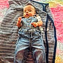 Natanael joined the competition — help win amazing prizes! baby, infant, denim_overalls, blanket, towel, plush_rug, colorful_background, face, hands, toes, feet, lying_down, portrait, clothing, cozy, indoor, newborn, cute, expression, baby_bedding