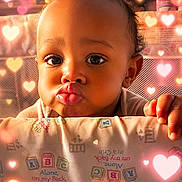 Hikeam Love joined the competition — help win amazing prizes! baby, child, infant, portrait, face, pouting, wide_eyes, curly_hair, smiling, crib, nursery, blanket, hands, indoor, close_up, heart_effects, warm_lighting, adorable, bedding, photograph