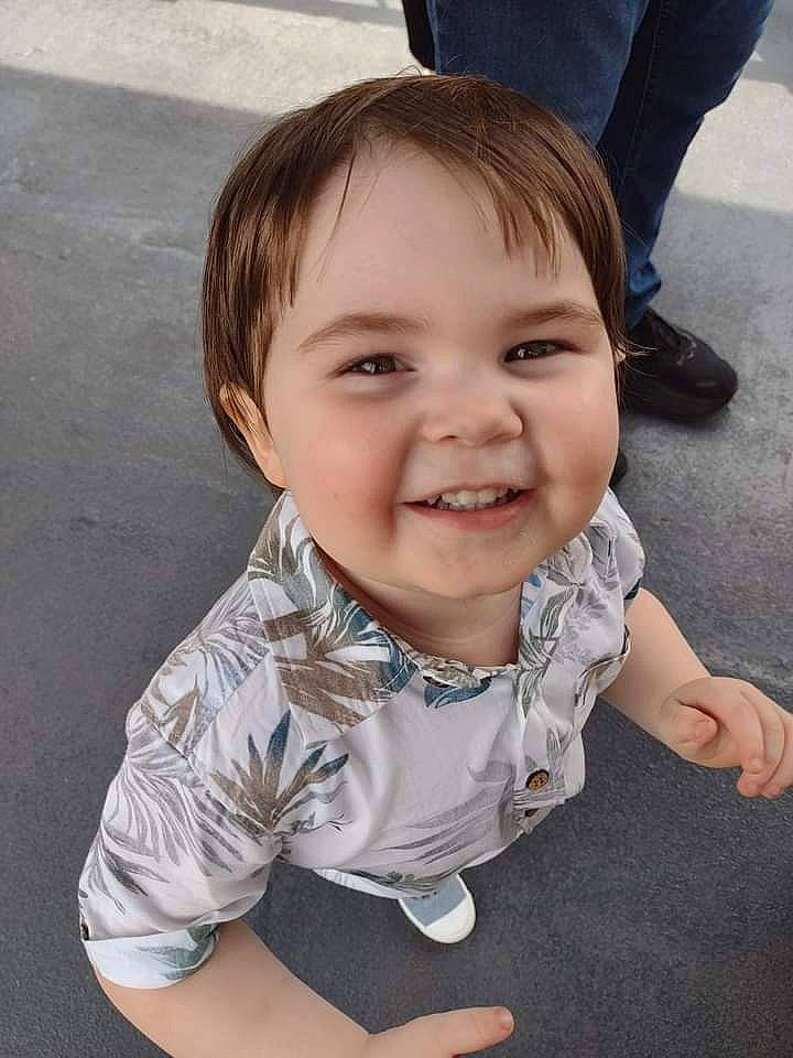 Aster is registered to the contest to win money with this photo: baby_toddler_clothing, cheek, chin, eye, face, finger, flash_photography, fun, gesture, grass, happy, human_body, iris, joy, lip, mouth, nose, person, skin, sleeve