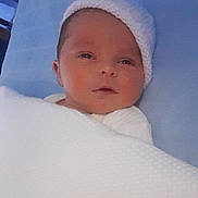 Deeana-Denise is registered to the contest to win money with this photo: baby, newborn, blanket, hat, sleeping, face, infant, cozy, resting, soft, cute, child, portrait, indoors, warm, knitted, peaceful, wrapped, young, lying_down