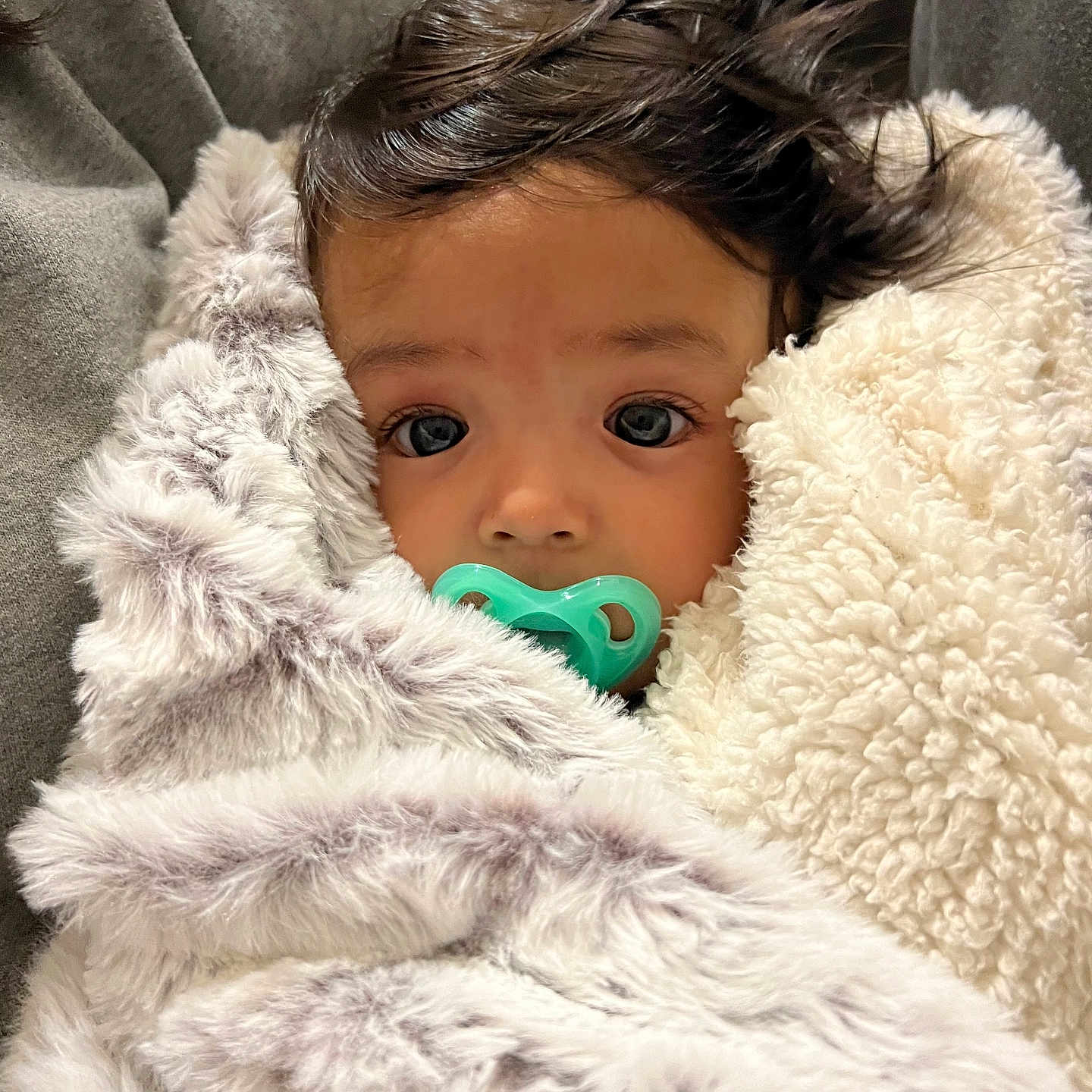 Khai joined the competition — help win amazing prizes! baby, blanket, clothing, coat, couch, face, furniture, head, homedecor, hood, jacket, knitwear, newborn, person, photography, portrait, quilt, sleeping, sweater, toy