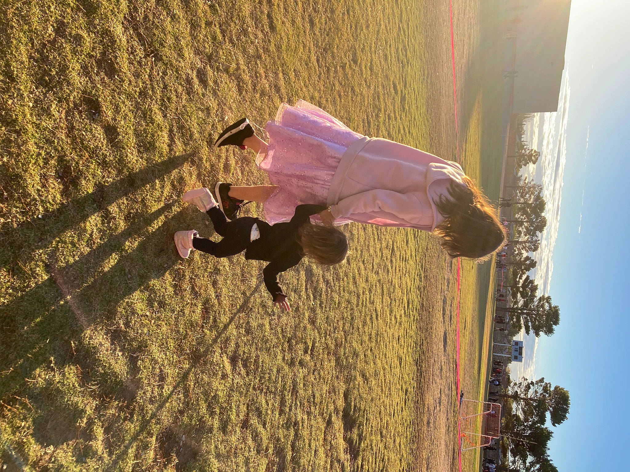 Amber is registered to the contest to win money with this photo: fun, grass, happy, landscape, leisure, morning, people_in_nature, person, plant, recreation, sky, street_light, summer, sunlight, tints_and_shades, tire, tree, wall, wheel, wood