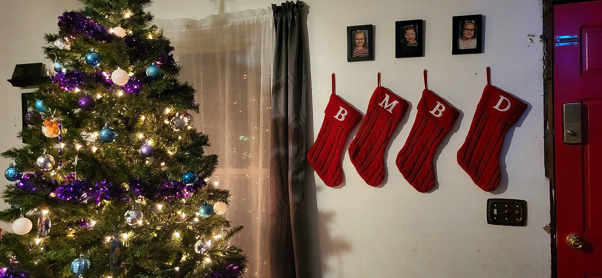 McKenzie is registered to the contest to win money with this photo: art, christmas_decoration, christmas_ornament, christmas_tree, event, evergreen, fashion_design, font, glove, holiday, holiday_ornament, interior_design, jersey, joy, ornament, person, red, room, sportswear, tints_and_shades