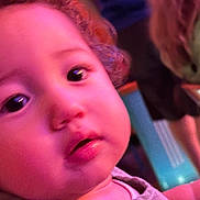 Elijah is registered to the contest to win money with this photo: baby, blur, blurry, cheeks, child, closeup, curious, expression, eyes, face, hair, head, human, indoor, mouth, person, pink_light, portrait, skin, young