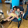 Elijah joined the competition — help win amazing prizes! baby, bag, ballet_shoes, blue_pillar, box, casual_wear, chair, children, colorful_clothing, curly_hair, event, family, floor, holding_hands, indoor, long_hair, people, playful, toddler, tutu
