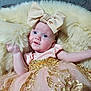 Ava is registered to the contest to win money with this photo: baby, child, infant, dress, bow, headband, fluffy, cushion, pink, gold, sequins, fabric, portrait, happy, smiling, indoor, soft, cute, person, young