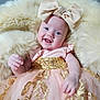 baby, infant, smiling, dress, bow, headband, pink, gold, sequins, fluffy, cushion, happy, portrait, child, cute, indoors, soft, closeup, face, person