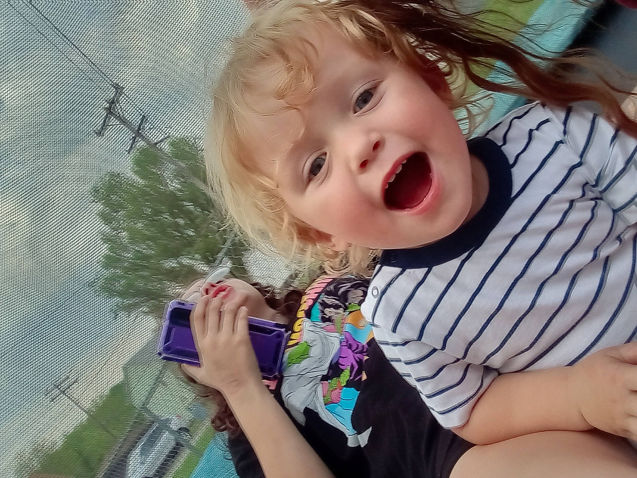 Elliot is registered to the contest to win money with this photo: arm, baby_toddler_clothing, cheek, cool, ear, eyelash, finger, gesture, happy, iris, lip, mouth, neck, nose, person, skin, sleeve, smile, summer, thumb