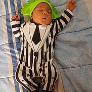 Serenity joined the competition — help win amazing prizes! baby, sleeping, infant, onesie, hat, striped_clothing, bed, blanket, blue, green, cute, peaceful, child, person, indoors, resting, cozy, soft, toddler, laying_down