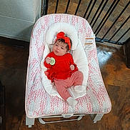 Serenity joined the competition — help win amazing prizes! baby, baby_girl, baby_rocker, casual, child, comfortable, cushion, cute, floor, headband, indoor, infant, newborn, pacifier, person, portrait, red_clothing, resting, safety_gate, tile_floor