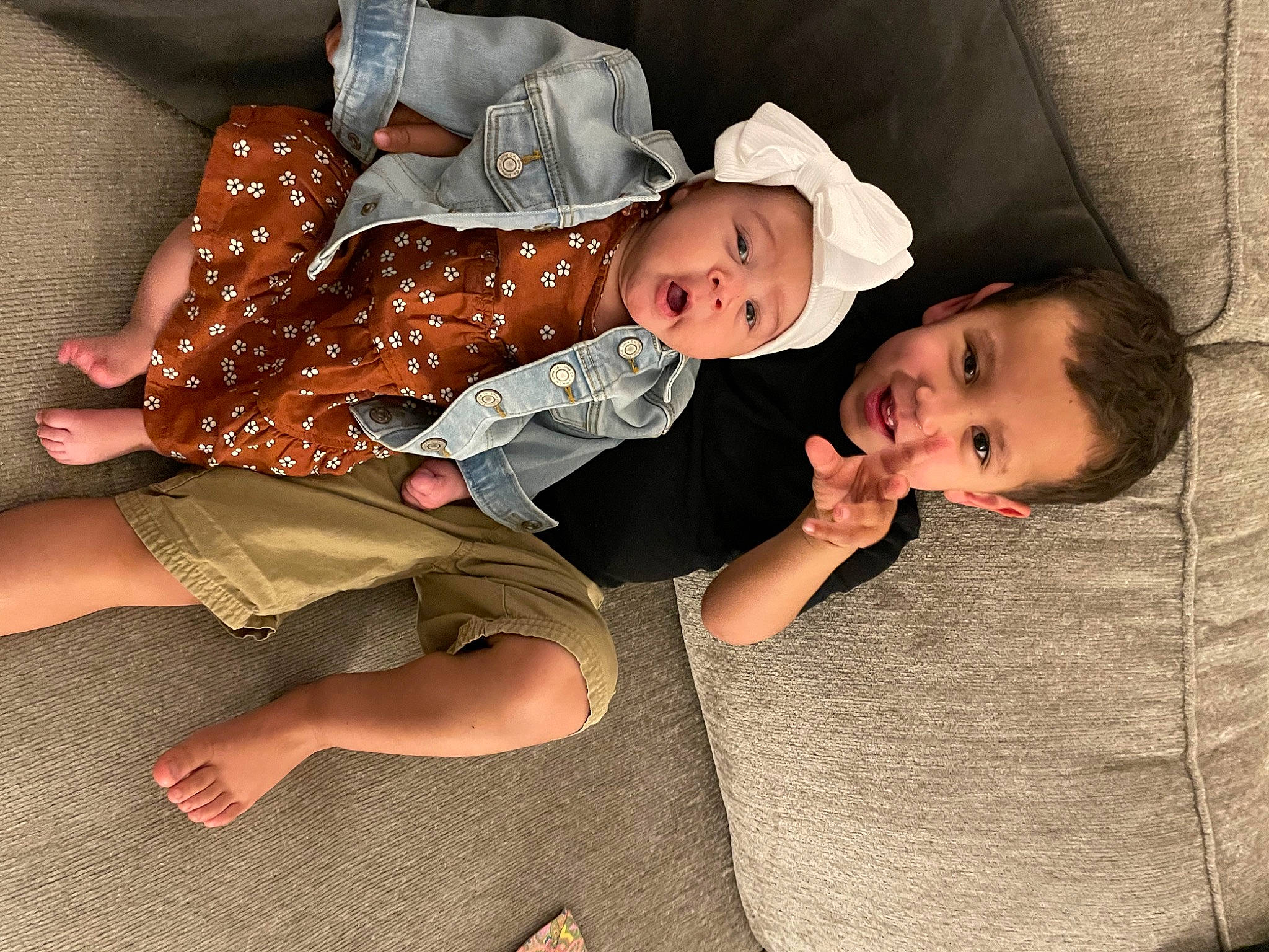 Carter is registered to the contest to win money with this photo: baby, baby_toddler_clothing, child, comfort, foot, fun, happy, hat, headgear, headwear, human_leg, lap, leg, mouth, person, shorts, sitting, skin, smile, thigh