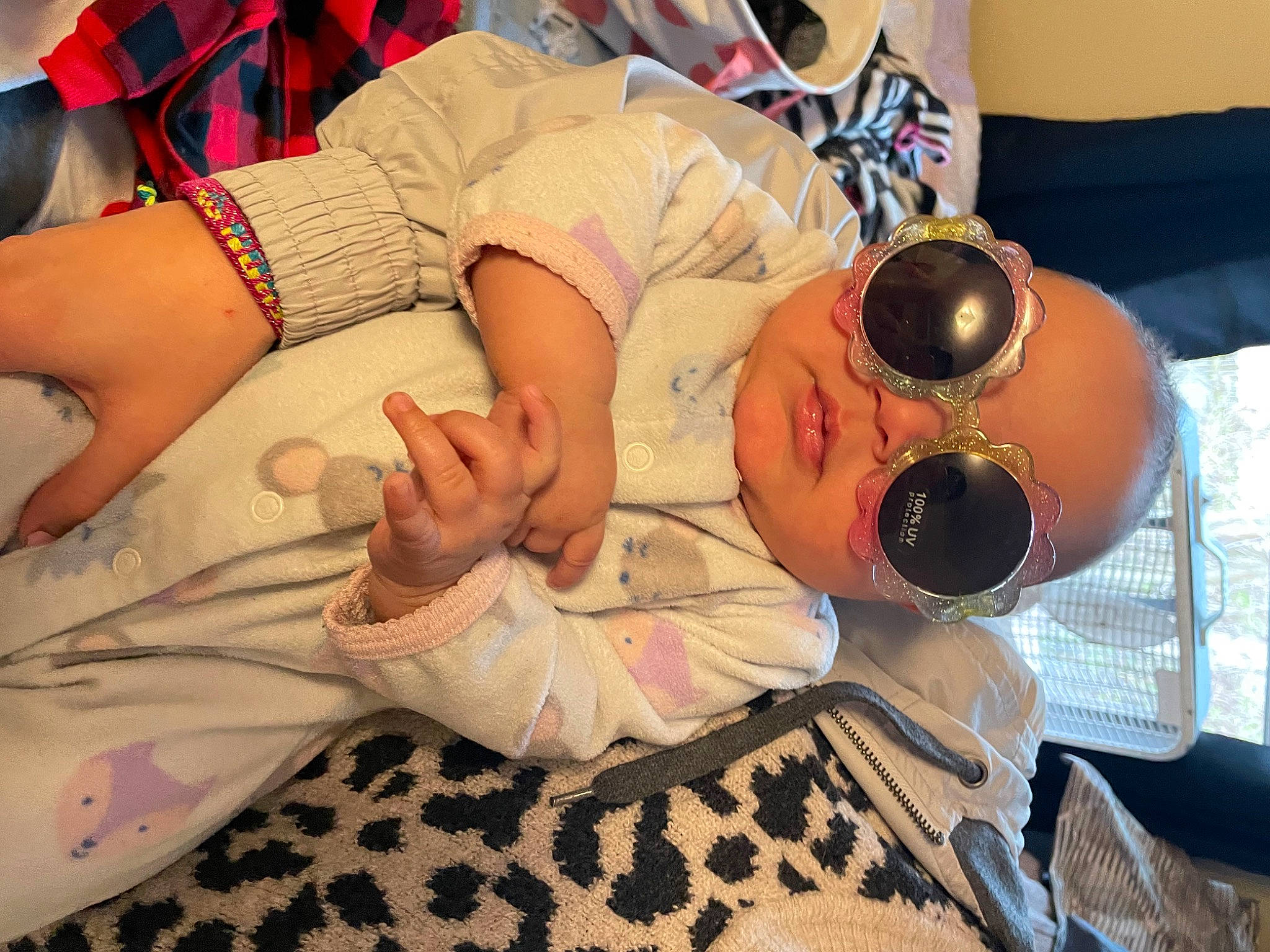 Daelynn is registered to the contest to win money with this photo: abdomen, arm, audio_equipment, chest, comfort, elbow, event, eyewear, finger, fun, goggles, human_leg, leisure, linens, nail, pattern, person, room, sunglasses, thigh
