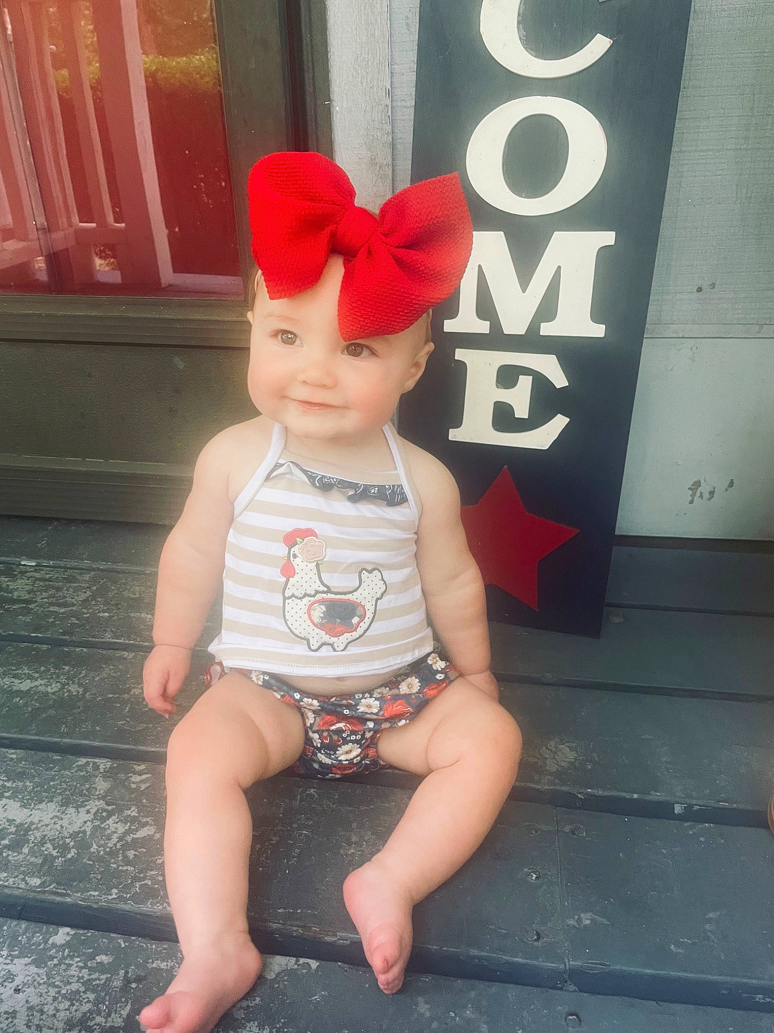 Molly Grace is registered to the contest to win money with this photo: baby, baby_toddler_clothing, cap, child, chin, costume_hat, eye, face, foot, fun, happy, hat, headwear, human_body, human_leg, joy, pattern, person, pink, sleeve