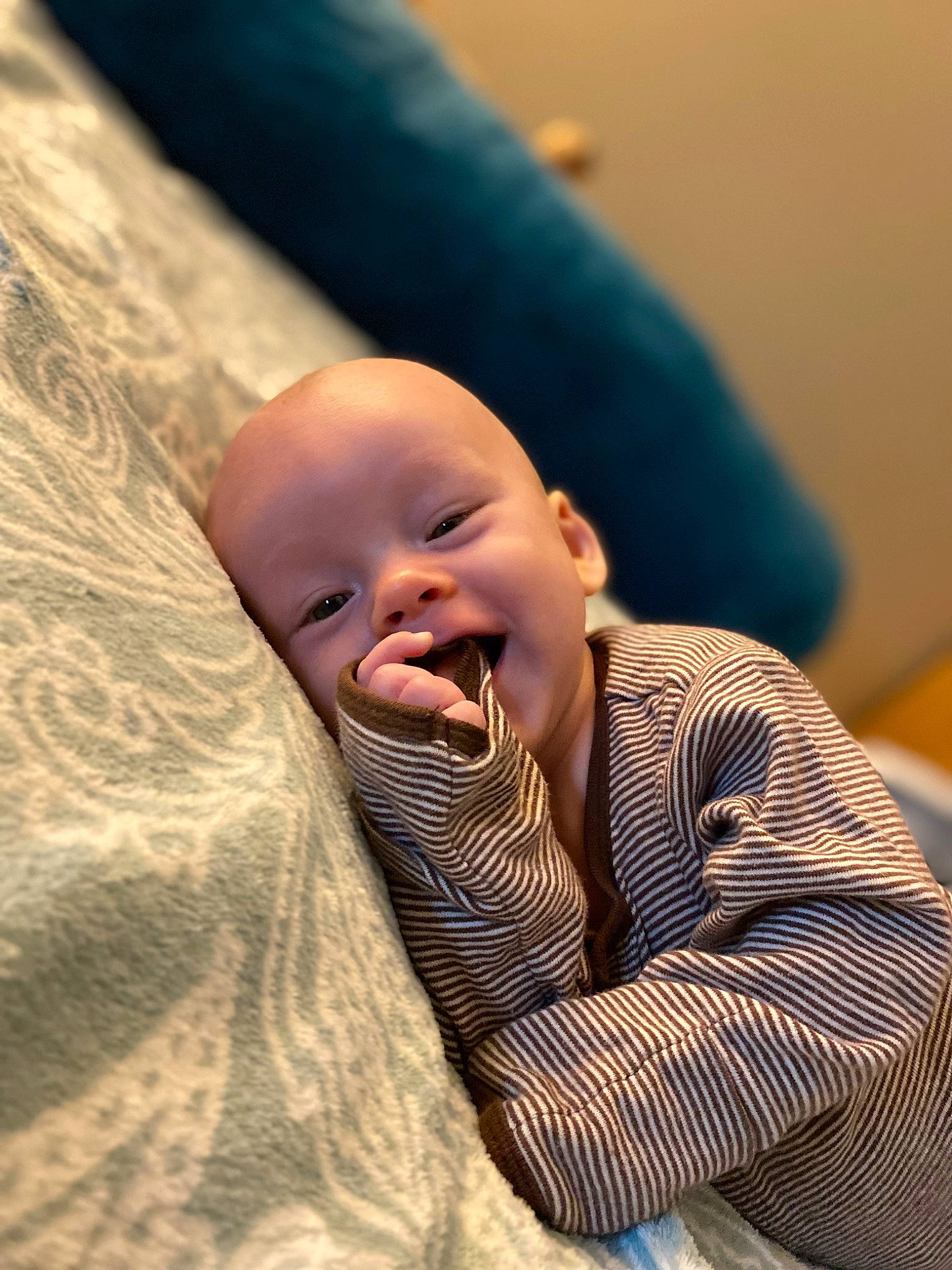 Judith is registered to the contest to win money with this photo: baby, baby_toddler_clothing, cheek, child, comfort, fun, gesture, happy, laugh, linens, nose, person, portrait_photography, room, sitting, skin, smile, textile, toddler, wood