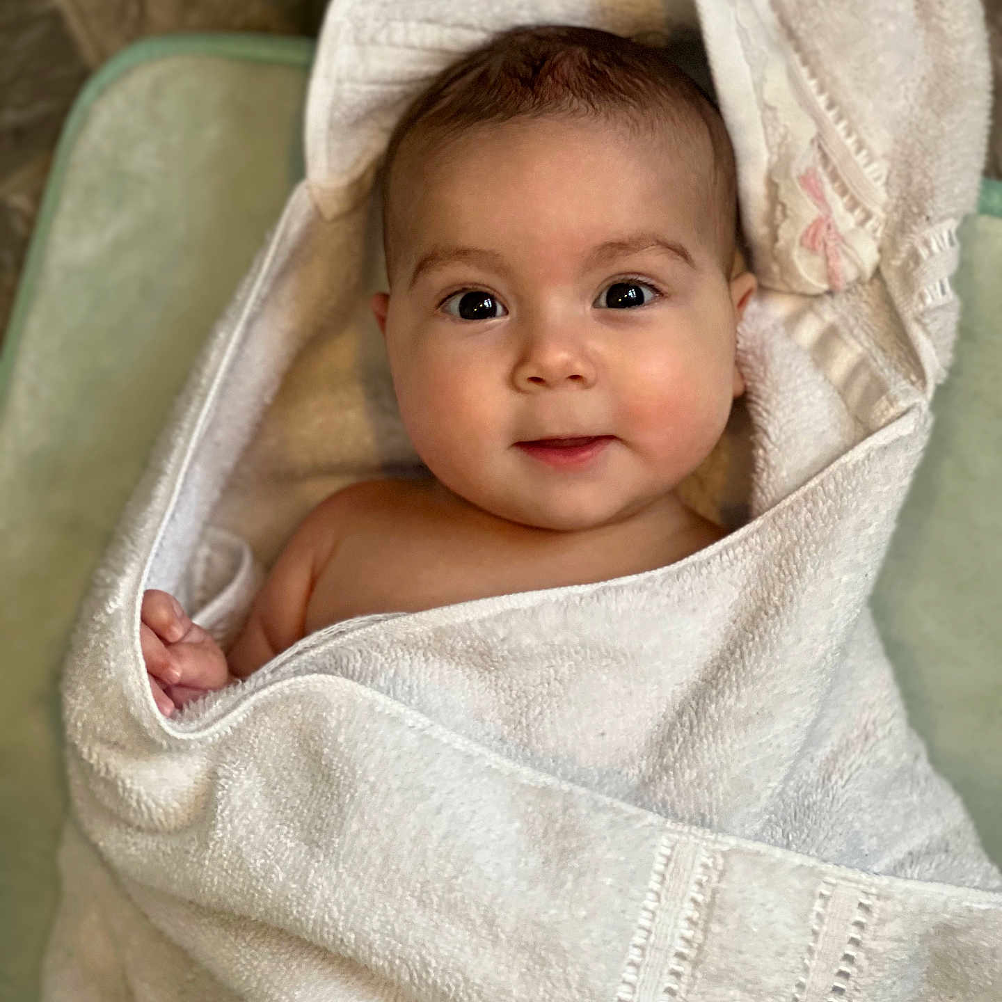 Genevieve is registered to the contest to win money with this photo: baby, blanket, child, cozy, cute, expression, eyes, face, head, indoors, infant, newborn, person, portrait, skin, smile, soft, towel, warm, wrapped