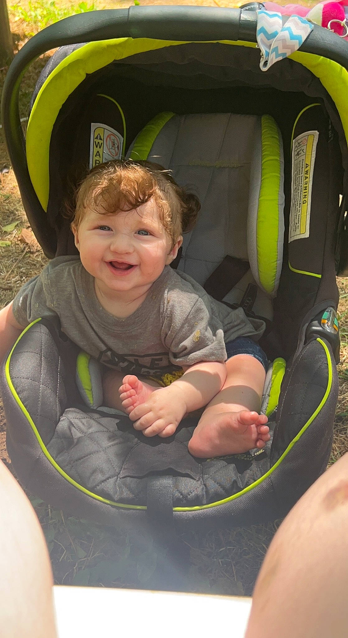 Lagertha is registered to the contest to win money with this photo: auto_part, automotive_tire, car_seat, child, comfort, fun, grass, green, happy, head, joy, leisure, motor_vehicle, people_in_nature, person, personal_protective_equipment, product, recreation, sitting, smile