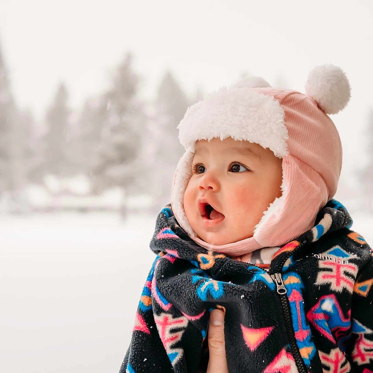 Brighid Namuun is registered to the contest to win money with this photo: baby, blanket, bonnet, cap, clothing, coat, face, happy, hat, head, hood, jacket, nature, outdoors, person, photography, portrait, scarf, snow, yawning