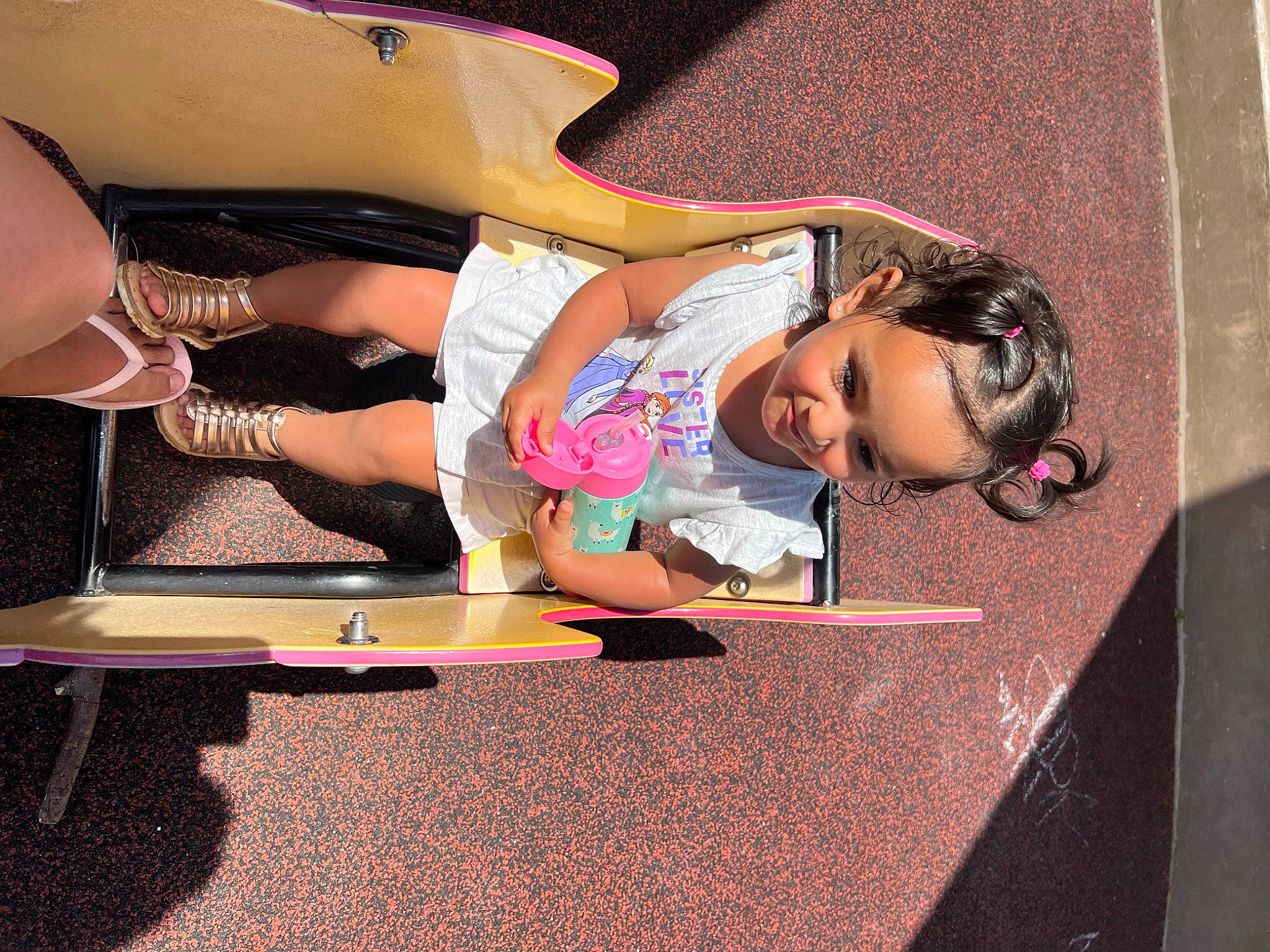 Mila joined the competition — help win amazing prizes! chest, child, comfort, eyewear, foot, fun, human_leg, joy, knee, lap, leisure, magenta, person, pink, recreation, room, shorts, sitting, t_shirt, thigh