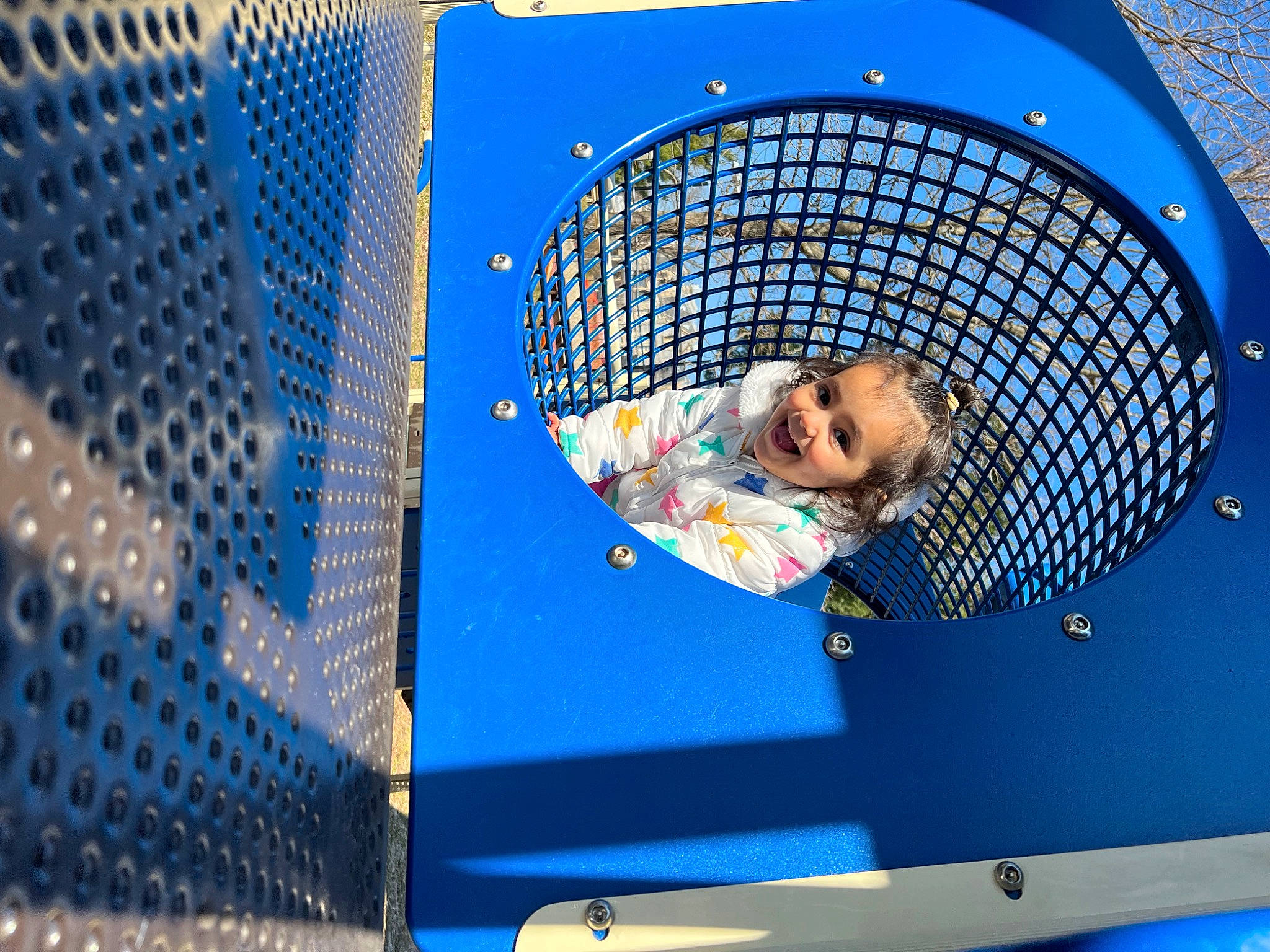 Mila is registered to the contest to win money with this photo: automotive_design, automotive_exterior, azure, blue, circle, electric_blue, event, fun, grille, hood, leisure, mesh, metal, net, pattern, person, recreation, space, technology, toddler