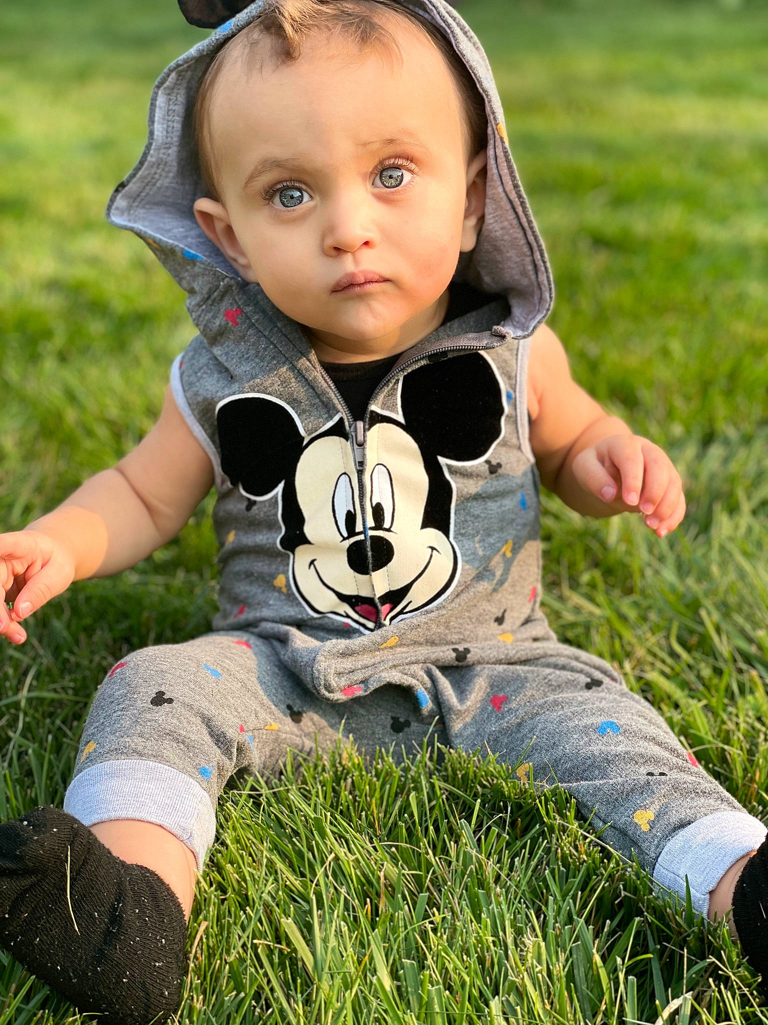 Reynaldo joined the competition — help win amazing prizes! baby, baby_toddler_clothing, child, face, fun, grass, grass_family, grassland, happy, lawn, leisure, meadow, pattern, people_in_nature, person, recreation, sitting, summer, sunlight, t_shirt