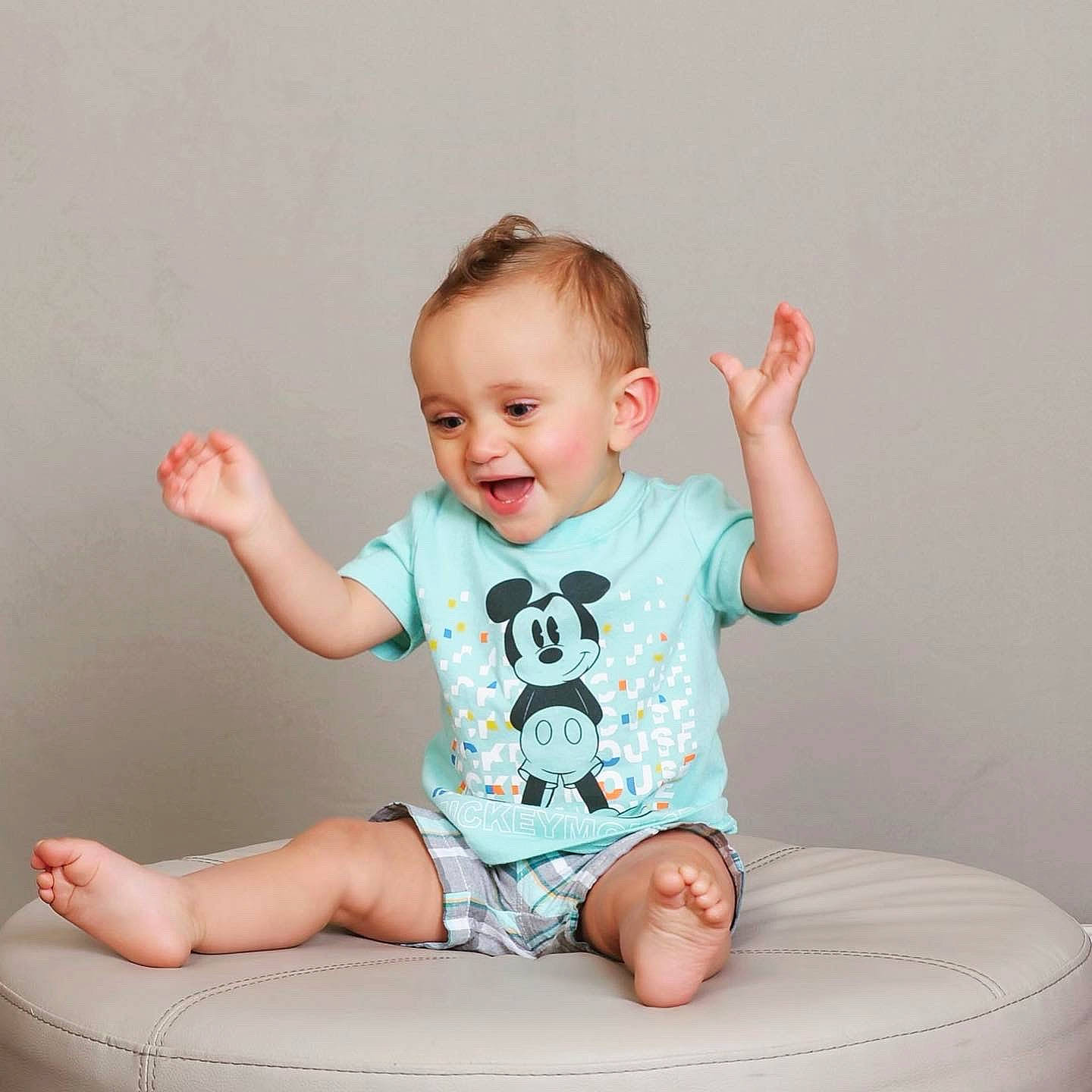 Reynaldo is registered to the contest to win money with this photo: arm, baby, baby_toddler_clothing, cheek, comfort, finger, flash_photography, hand, happy, joint, knee, leg, person, pink, shorts, skin, sleeve, smile, stomach, t_shirt