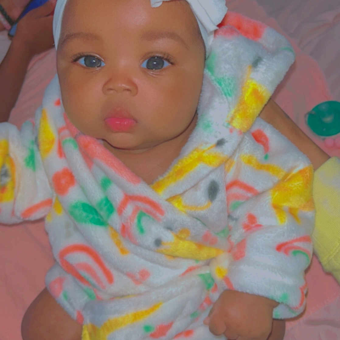 Yuri is registered to the contest to win money with this photo: baby, baby_safety, baby_toddler_clothing, cheek, comfort, dress, eye, eyelash, face, head, headgear, human_body, iris, lip, mouth, nose, pink, skin, sleeve, toddler