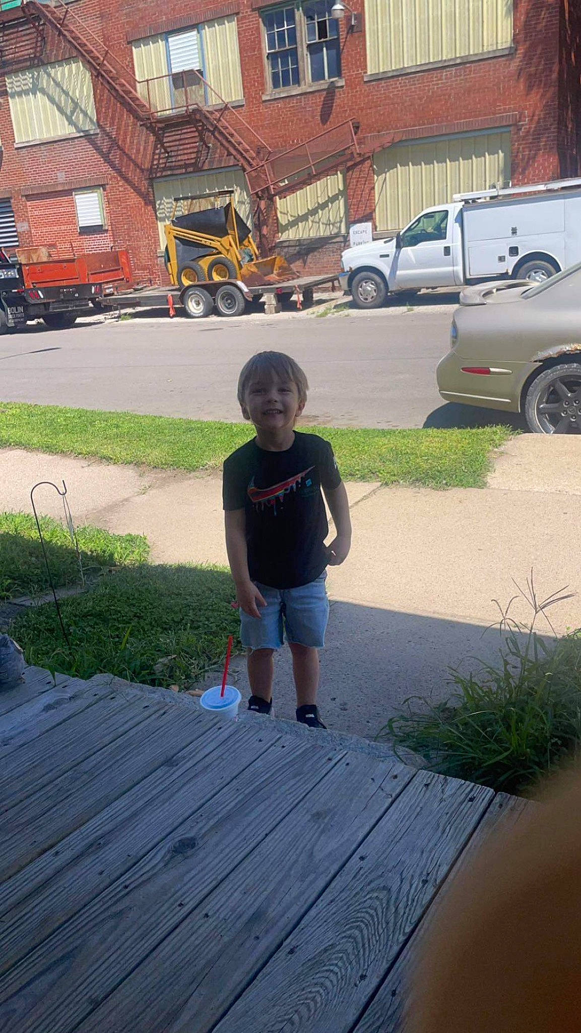 Karson joined the competition — help win amazing prizes! asphalt, building, car, grass, house, joy, leisure, motor_vehicle, person, plant, road, road_surface, shorts, sidewalk, t_shirt, tire, toddler, vehicle, vehicle_door, wheel