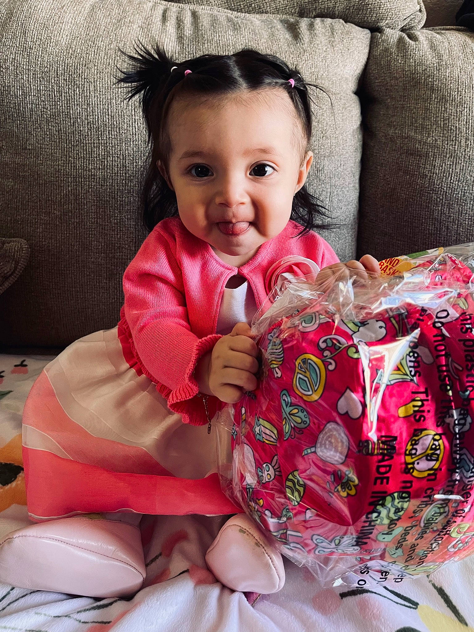 Kamila is registered to the contest to win money with this photo: baby, baby_toddler_clothing, cheek, comfort, dress, finger, hairstyle, happy, head, human_body, lip, neck, outerwear, person, pink, skin, sleeve, smile, textile, thigh