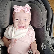 Amara joined the competition — help win amazing prizes! baby, smiling, pink_bow, car_seat, gray_cushion, infant, happy, child, cute, clothing, headband, person, seated, indoor, portrait, babygirl, apparel, babywear, childcare, infantwear