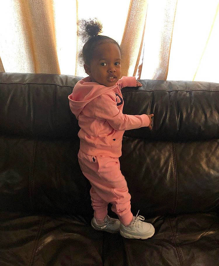 Charleigh is registered to the contest to win money with this photo: arm, child, gesture, person, smile, standing, toddler