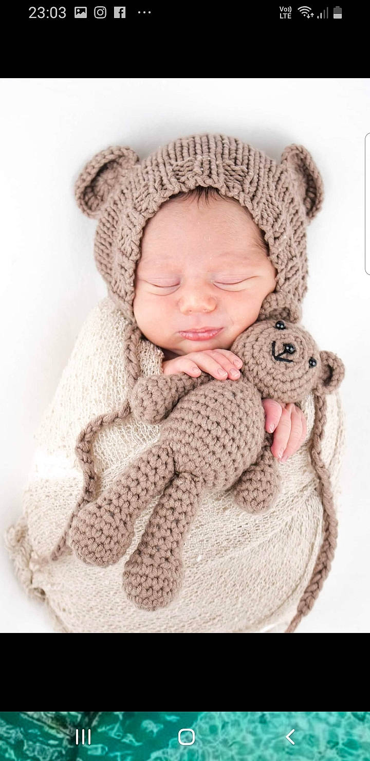 Arlo joined the competition — help win amazing prizes! art, baby, baby_toddler_clothing, cap, child, comfort, crochet, fashion_accessory, fur, grey, hand, head, knit_cap, linens, pattern, person, skin, sleeve, toddler, wool