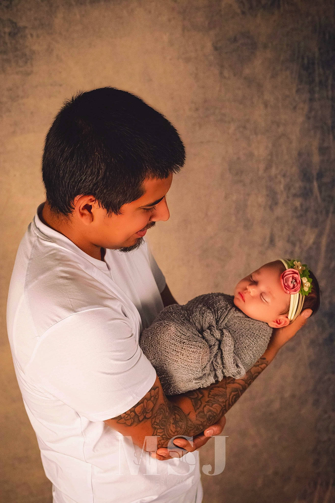 Gabriella is registered to the contest to win money with this photo: abdomen, arm, baby, child, elbow, event, flash_photography, fun, gesture, hand, happy, hug, love, person, sitting, sleeve, smile, t_shirt, toddler, tradition