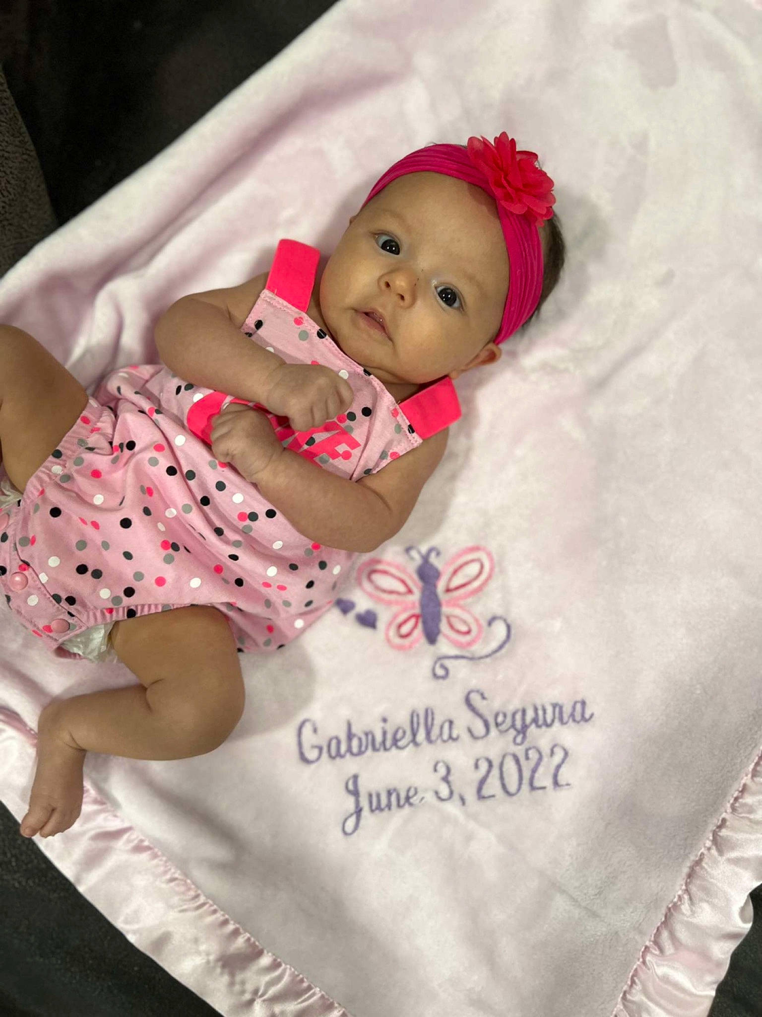 Gabriella joined the competition — help win amazing prizes! baby, baby_products, baby_toddler_clothing, cheek, child, comfort, face, happy, headwear, linens, magenta, pattern, person, pink, product, room, skin, sleeve, t_shirt, textile