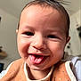 Keïron a rejoint le concours — aidez-le/la à gagner de superbes lots ! baby, smiling, tongue_out, close_up, face, child, indoor, bib, happy, cute, portrait, infant, person, skin, head, clothing, young, expression, baby_bib, cheerful