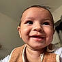 Keïron participe au concours pour gagner de l'argent avec cette photo : baby, smiling, face, closeup, indoors, child, bib, cute, happy, person, infant, skin, clothing, portrait, expression, young, head, eyes, mouth, cheeks