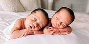 Twins is registered to the contest to win money with this photo: newborn, twins, sleeping, baby, infant, bed, white_bed, peaceful, cute, resting, soft_light, indoor, portrait, baby_skin, tiny_hands, cozy, closeup, head, sleep, child