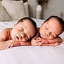 newborn, twins, sleeping, baby, infant, bed, white_bed, peaceful, cute, resting, soft_light, indoor, portrait, baby_skin, tiny_hands, cozy, closeup, head, sleep, child