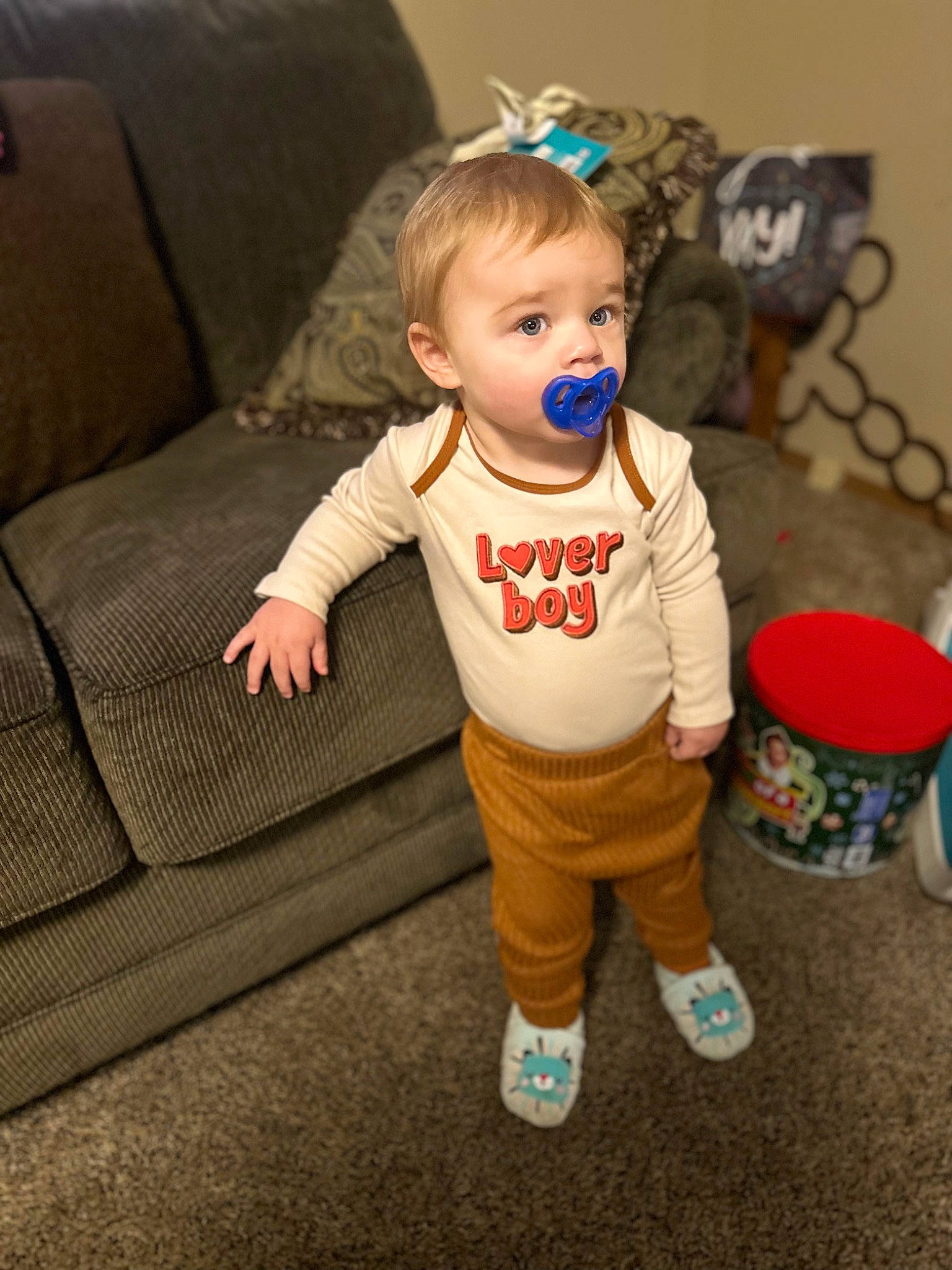 Malachi is registered to the contest to win money with this photo: baby, baby_toddler_clothing, cheek, child, clothing, comfort, couch, flooring, fun, happy, hardwood, person, room, sitting, sleeve, smile, sock, sofa_bed, studio_couch, toddler