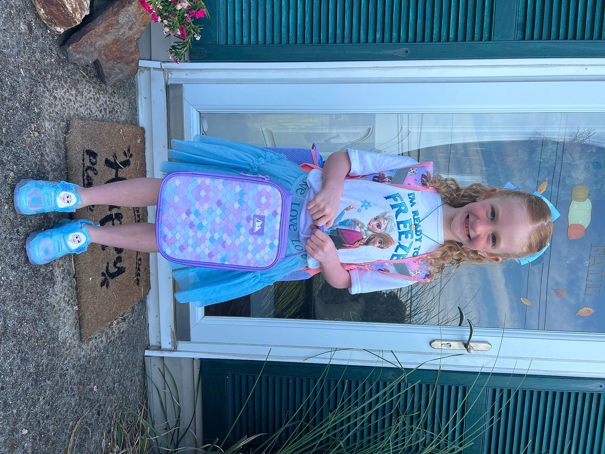 Aubree is registered to the contest to win money with this photo: baby, baby_toddler_clothing, blue, child, electric_blue, flower, flowerpot, foot, fun, houseplant, human_leg, joy, leisure, magenta, pattern, person, pink, plant, smile, thigh